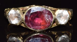 A 19thC gold ring set with a foiled garnet and rose cut foiled paste, 3.8g, size P
