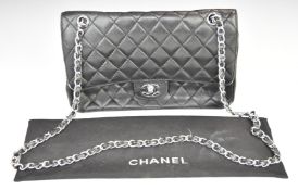 Vintage Chanel black leather handbag with classic double strap and silver coloured fittings, 17 x
