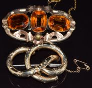 Victorian yellow metal knot brooch and another Victorian brooch set with paste, largest 6cm