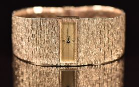 Bueche Girod 9ct gold ladies wristwatch with blued hands, black Roman numerals, gold dial and signed