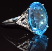 A 9ct white gold ring set with a topaz and diamonds, 6.2g, size R
