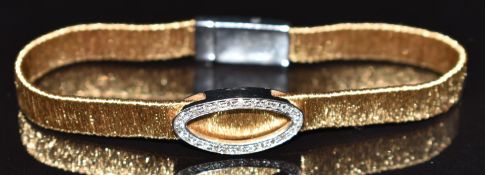 An 18ct gold bi-coloured bespoke bracelet set with diamonds in an oval, marked OMS, 20.2g, 20cm