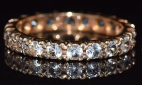 A 9ct gold eternity ring set with spinel, 2.8g, size O