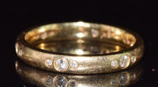 An 18ct gold eternity ring set with diamonds totalling approximately 0.24ct, 3.8g, size N