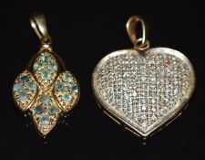 A 9ct gold pendant in the form of a heart set with diamonds and a 9ct gold pendant set with