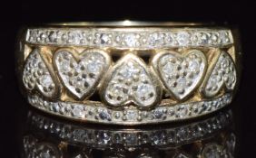 A 9ct gold ring set with diamonds in heart shaped settings, 6.2g, size P