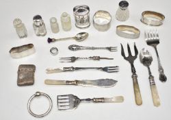 Four various hallmarked silver napkin rings, hallmarked silver vesta case, silver topped items