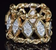 An 18ct gold ring made up of rope twist and diamond shaped decoration set with diamonds to five