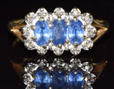 A 9ct gold ring set with three oval cut sapphires and diamonds, 2.5g, size N