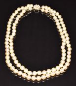 A double strand of cultured pearls, the 9ct gold clasp set with pearls, 58.2g
