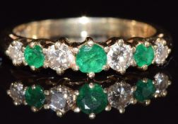 A 14k gold ring set with alternating diamonds and emeralds, 3.1g, size L