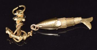 An 18ct gold anchor pendant (1.2g) and a yellow metal articulated charm in the form of a fish, 1.5g
