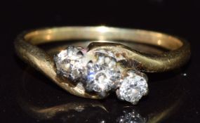 An 18ct gold ring set with diamonds in a twist setting, 2.1g, size J
