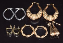 A pair of 9ct bi-coloured gold earrings, two pairs of 9ct gold loops, a pair of 9ct white gold hoops