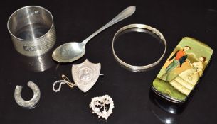 Silver napkin ring, spoon, silver bangle, silver heart shaped brooch with swallow decoration (