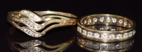 A 9ct gold eternity ring set with paste and a 9ct gold ring set with diamonds, 4.3g, size M & V