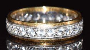 An 18ct gold eternity ring set with spinel, 4.2g, size N