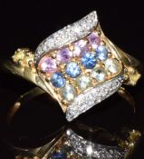 A 9ct gold ring set with diamonds and pink, blue and green sapphires, 2.8g, size N