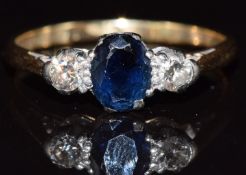 An 18ct gold ring set with a sapphire and diamonds, 3.5g, size R