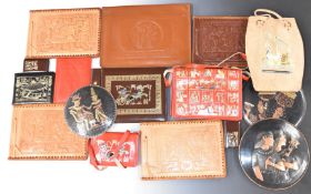 A collection of leather items with embossed Egyptian designs including albums, photo frame, bag etc