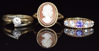 Three 9ct gold rings, one set with a cameo and two with cubic zirconia, 7.6g