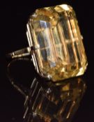 A 9ct gold ring set with an emerald cut citrine measuring 20.7 x 27.3mm, 18.4g, size N