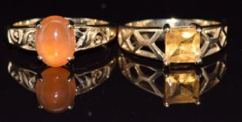 Two 9ct gold rings, one set with a princess cut citrine and the other a garnet cabochon, 5.4g,