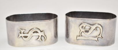 Pair of Elizabeth II hallmarked silver napkin rings decorated with initials, Birmingham 1965, makers