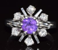 An 18ct white gold ring set with an amethyst and diamonds totalling approximately 0.48ct, 5.6g, size