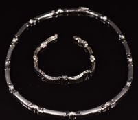 A suite of 14ct white gold jewellery set with cubic zirconia comprising necklace and bracelet, 35.