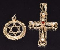 A 9ct gold cross pendant set with garnets and cubic zirconia and a 9ct gold Star of David pendant,