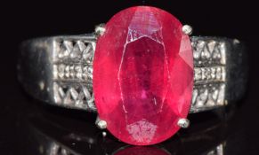 A 9ct white gold ring set with a ruby and diamonds, 6.5g, size W