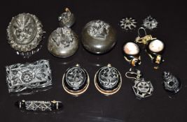A collection of Victorian jet including two lockets with a relief carved cameo and lily of the