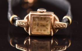 Avia 9ct gold ladies wristwatch with gold hands, Arabic numerals and hour markers, silver dial and