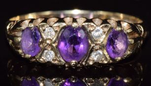 A 9ct gold ring set with amethysts and diamonds, 1.9g, size M