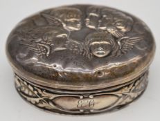 Edward VII hallmarked silver tinket box decorated with Reynolds Angels to the lid, Chester 1902,