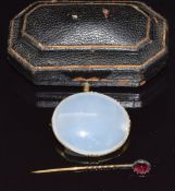 A 9ct gold agate brooch and a Victorian stick pin set with a foiled garnet