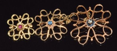 Three 9ct gold brooches, one set with a diamond, one sapphire and one ruby, 7g