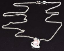 An 18ct white gold pendant in the form of a heart set with diamonds and a pearl (2g), on a 14k white