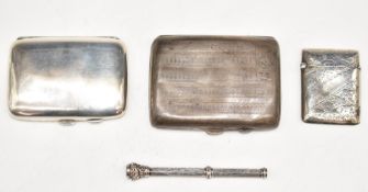 Two hallmarked silver cigarette cases, hallmarked silver vesta case and a silver retractable pencil,