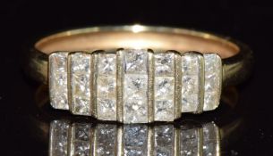 A 9ct gold ring set with princess cut diamonds, 2.2g, size T
