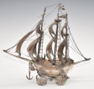 Spanish silver novelty table centrepiece model of a ship or galleon on wheels, marked to one of