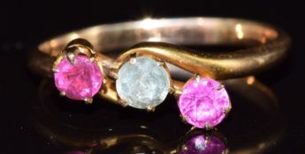 An 18ct gold ring set with an aquamarine, ruby and tourmaline, 2.4g, size N