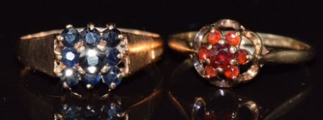 A 9ct gold ring set with garnets and a 9ct gold ring set with sapphires, 3.8g, size Q