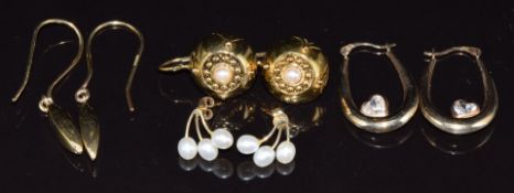 Three pairs of 9ct gold earrings one set with pearls (3.7g) and one pair of silver gilt earrings