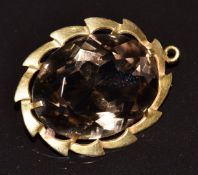 A 9ct gold pendant set with a smoky quartz, 7.6g, 3 x 2.4g