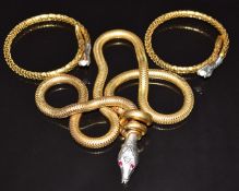 A vintage serpent necklace with synthetic ruby eyes and two rolled gold Art Deco German serpent