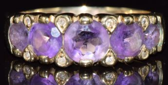 A 9ct gold ring set with five amethysts and diamonds, 3.5g, size P