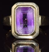 A 9ct gold ring set with an emerald cut amethyst, 5g, size O