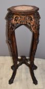 Chinese carved Padauk wood jardinière stand with marble inset top, height 92cm, width of top 35cm